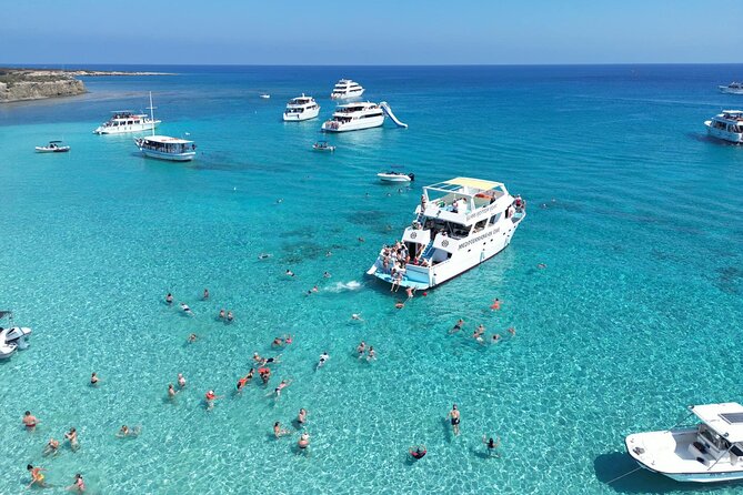 Blue Lagoon Akamas Bus and Boat Tour with Water Slide from Paphos - Sea Caves: a quick opening view