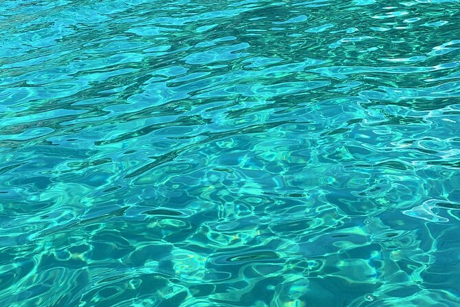 Blue Lagoon cruise: giant slide, music & Paphos hotel transfers - Manolis Bay and the Manolis Cave