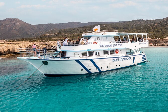Blue Lagoon cruise: giant slide, music & Paphos hotel transfers - Drinks, fruit, snacks, and the onboard mood