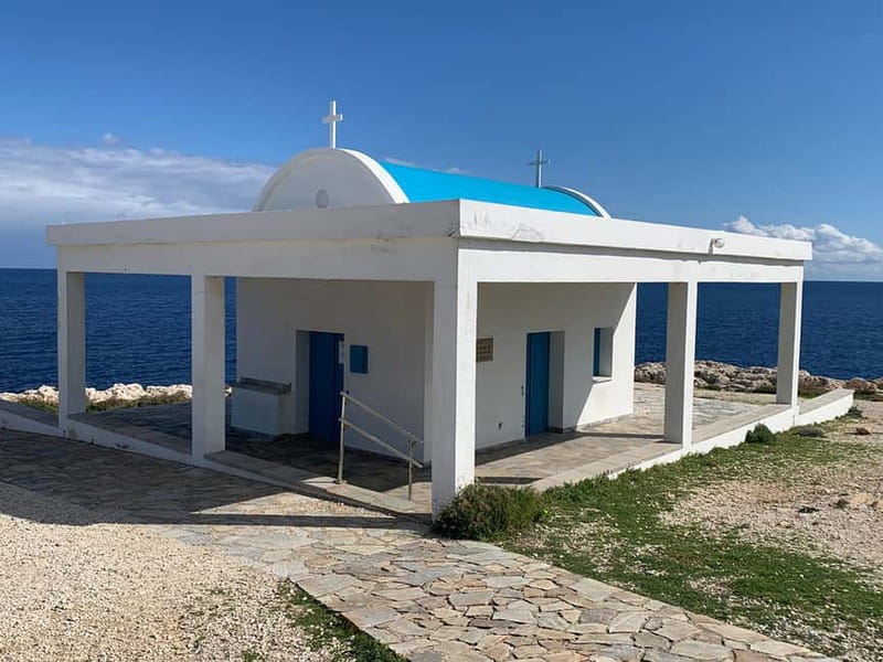 Cape Greco Region - private guided Highlight Tour - Red soil, trees, and bare rock