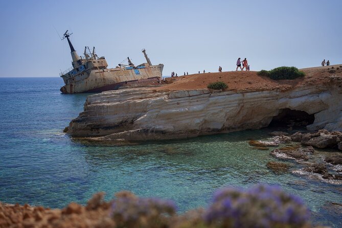 From Paphos Highlight Tour with Baths of Aphrodite & Blue Lagoon - The Paphos sea caves and white stones