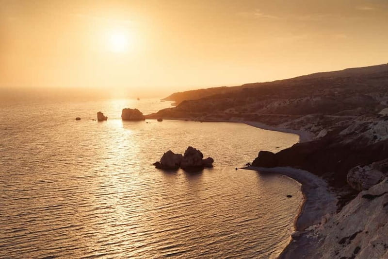 From Paphos: Sunset Drink at Aphrodite's Rock & Folk Dinner - From mythic rock to Kouklia village