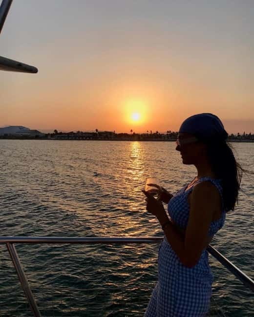 Larnaca: Sunset Cruises – Traditional Explorer N Vessel - Sunset views with mountains, sea, and airport traffic