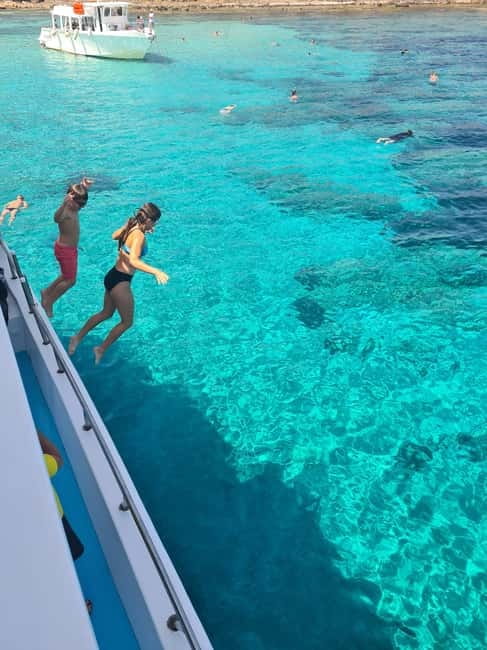 Latsi: Blue Lagoon Boat Trips with Traditional BBQ - Choosing your place on the boat