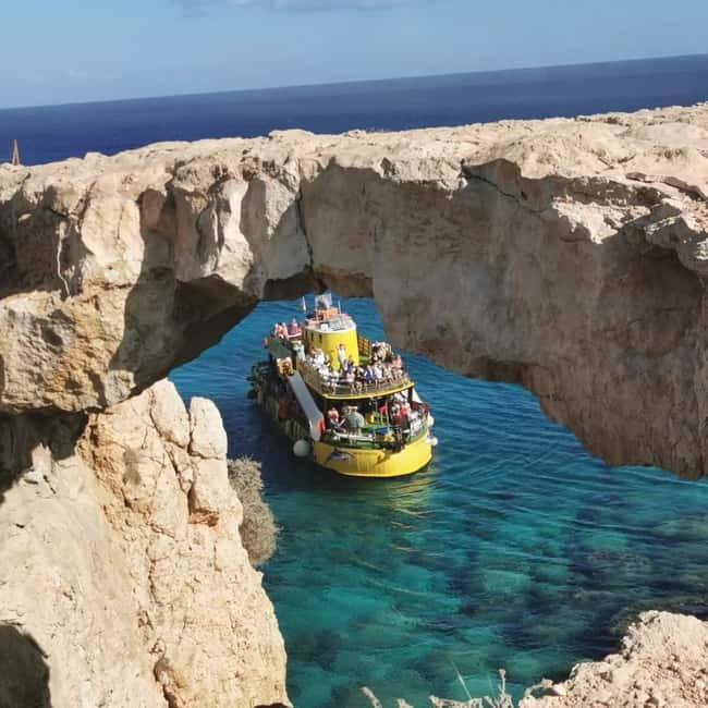 Protaras: Blue Lagoon, Sea Caves and Turtle Cove Sunset Trip - Cape Greco sea caves and Lover’s Bridge