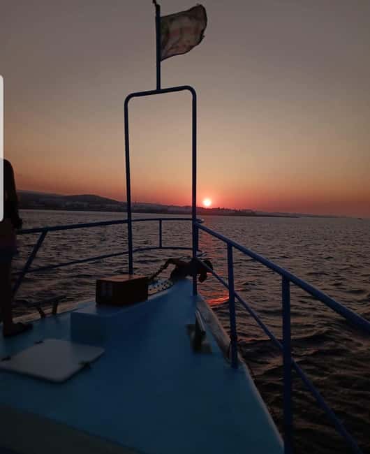 Protaras Blue Lagoon Sunset Tour with Pizza & Champagne - Champagne, pizza, fruit, and the return cruise