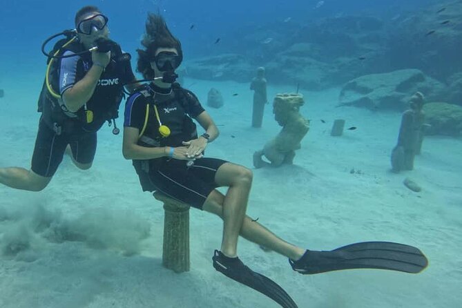 Scuba Diving Adventure at Green Bay Beach - Ancient Greek statues make this more than a reef visit